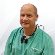 Photo of medical practitioner with SurgiTel loupes and LED headlights
