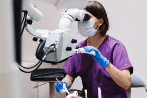 Dentist looking through scope